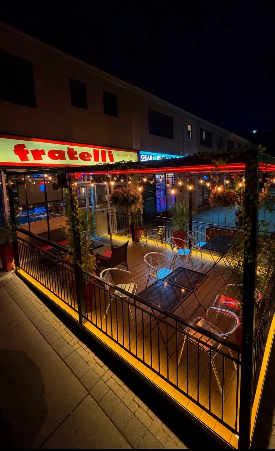 Private patio with seating and warm string lights